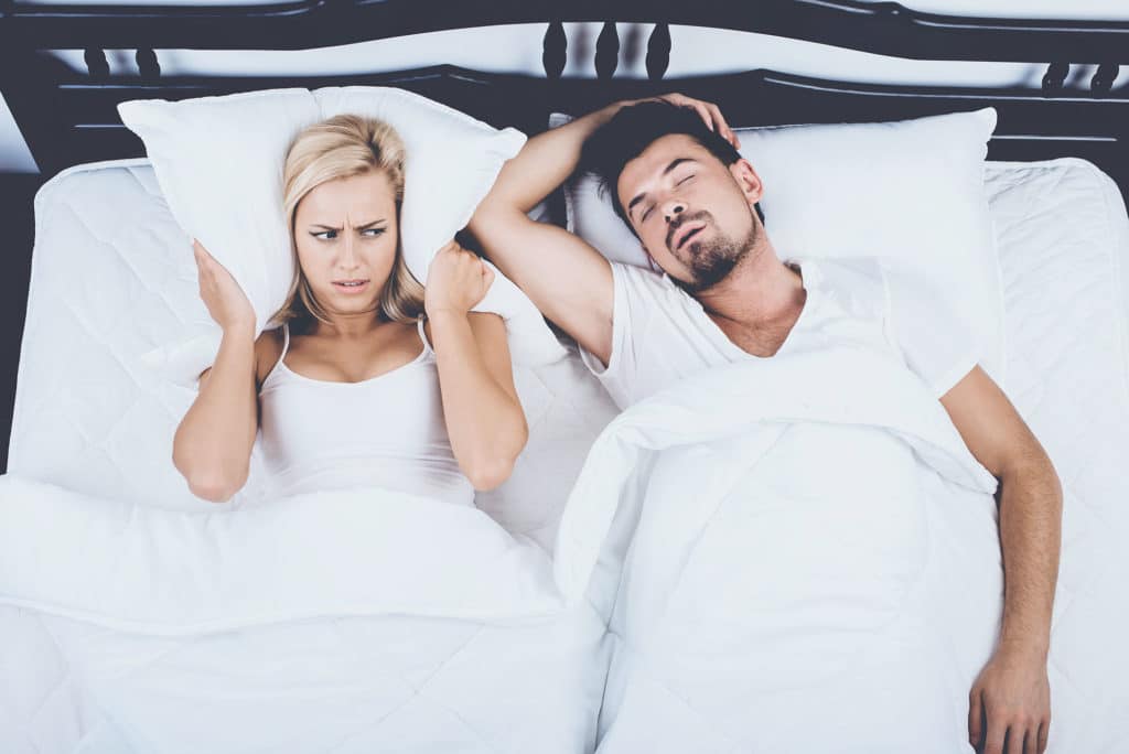Woman annoyed by mans sleep apnea